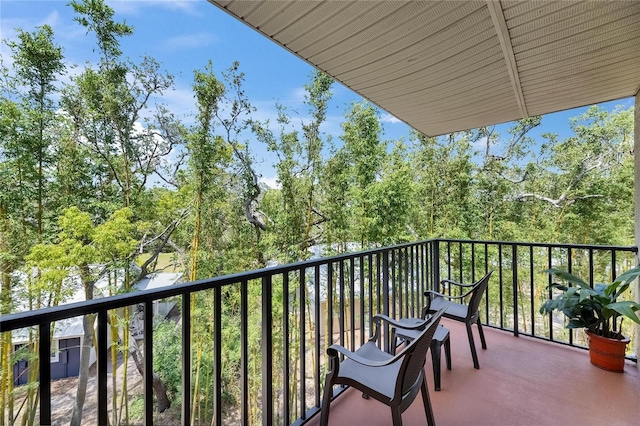 1420 Bayshore Blvd Unit 409, Dunedin, FL 34698 - balcony with view of wooded area