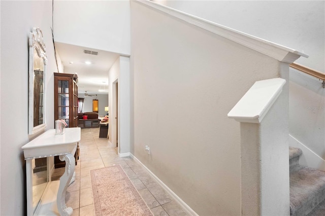 9617 Channing Hill Dr, Ruskin, FL 33573 - hall featuring light tile patterned floors, stairs, and visible vents