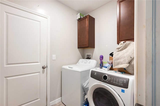 9617 Channing Hill Dr, Ruskin, FL 33573 - laundry area with cabinet space and washer and clothes dryer