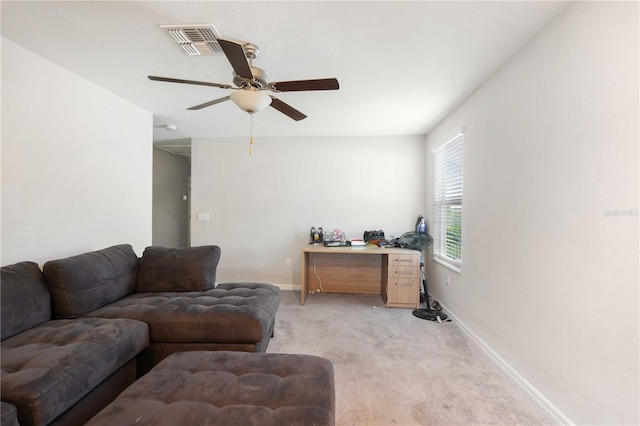 9617 Channing Hill Dr, Ruskin, FL 33573 - living area featuring baseboards, visible vents, a ceiling fan, and light carpet