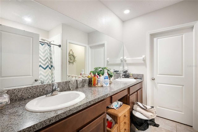 9617 Channing Hill Dr, Ruskin, FL 33573 - bathroom featuring double vanity, a sink, tile patterned floors, and a shower with shower curtain