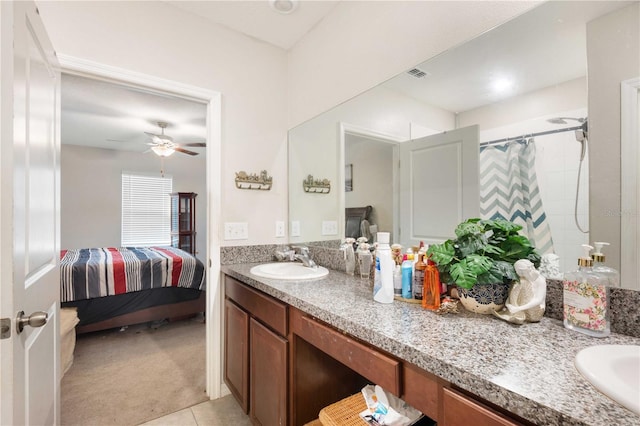 9617 Channing Hill Dr, Ruskin, FL 33573 - ensuite bathroom with tile patterned flooring, a shower with shower curtain, ceiling fan, ensuite bathroom, and vanity