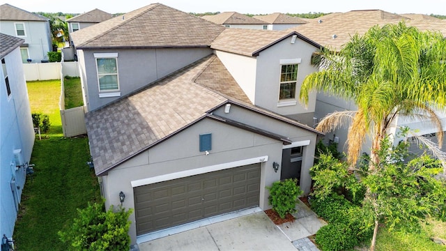 9617 Channing Hill Dr, Ruskin, FL 33573 - view of front of house featuring concrete driveway, a garage, stucco siding, and roof with shingles