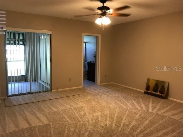 2450 Canadian Way Unit 6, Clearwater, FL 33763 - spare room with baseboards, ceiling fan, and carpet flooring