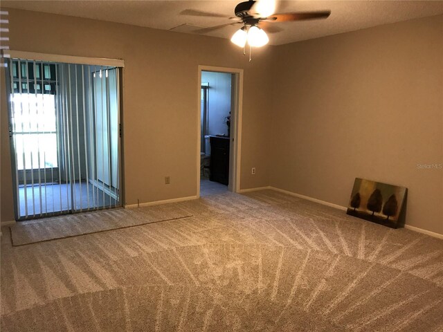 2450 Canadian Way Unit 6, Clearwater, FL 33763 - spare room featuring carpet flooring, ceiling fan, and baseboards