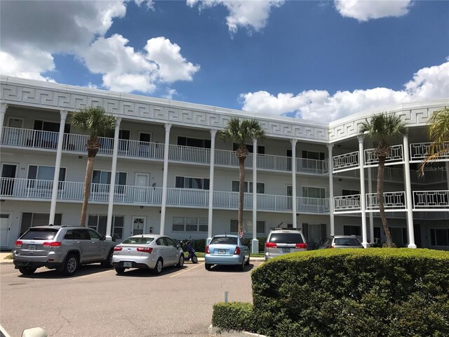 2450 Canadian Way Unit 6, Clearwater, FL 33763 - view of apartment building / complex featuring uncovered parking