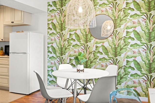 dining space featuring light wood-type flooring