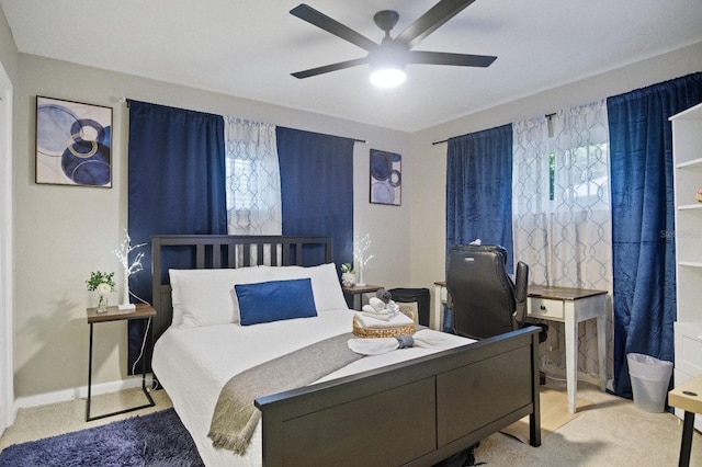 bedroom featuring baseboards, a ceiling fan, and carpet floors