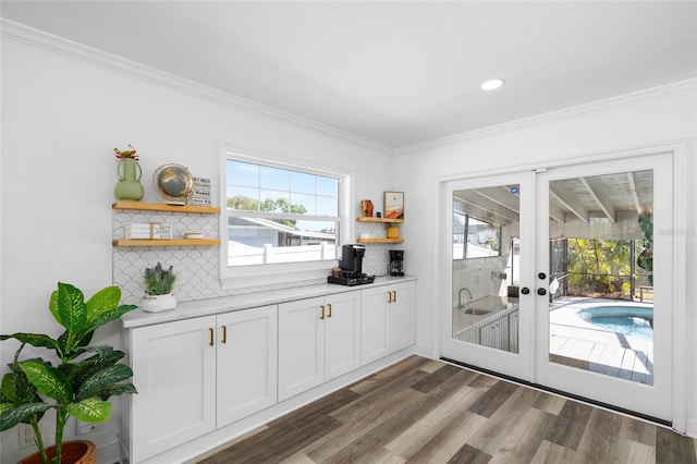 doorway featuring french doors, recessed lighting, ornamental molding, and dark wood finished floors