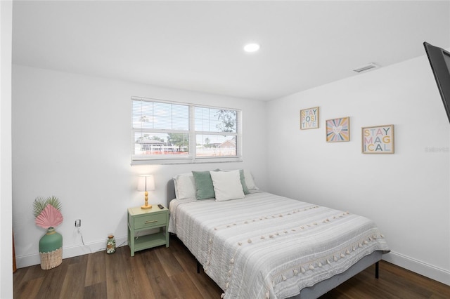 bedroom with recessed lighting, visible vents, wood finished floors, and baseboards