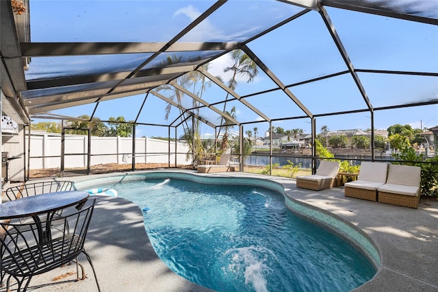 view of pool with a patio, a fenced in pool, a water view, fence private yard, and a lanai