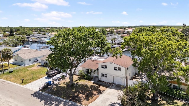 bird's eye view featuring a residential view and a water view