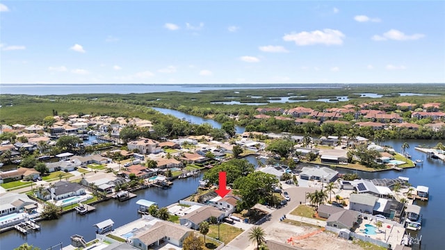 bird's eye view with a residential view and a water view