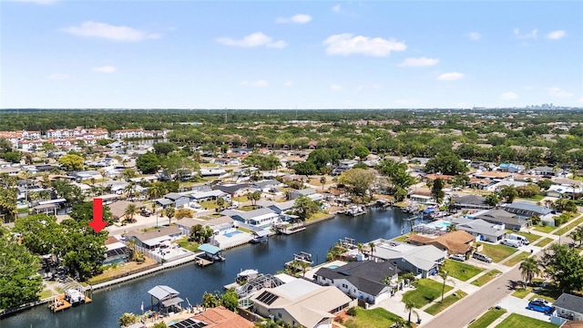 birds eye view of property featuring a water view and a residential view