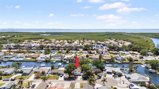 birds eye view of property featuring a residential view and a water view