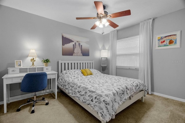 carpeted bedroom with baseboards and ceiling fan