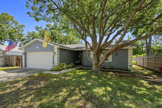 view of front of home featuring fence, an attached garage, a front lawn, stucco siding, and driveway