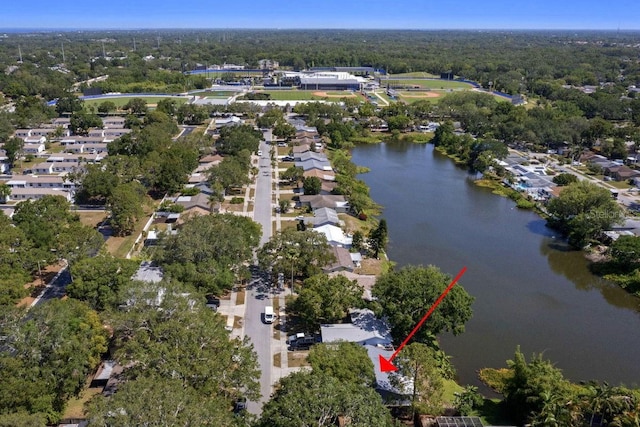 bird's eye view featuring a water view, a residential view, and a forest view