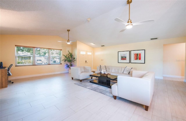 living room with a ceiling fan, visible vents, vaulted ceiling, and baseboards