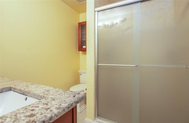 full bath featuring visible vents, a stall shower, toilet, and vanity