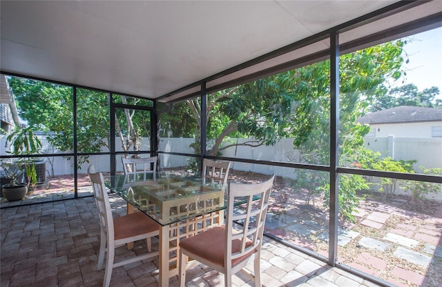 sunroom / solarium with outdoor dining area