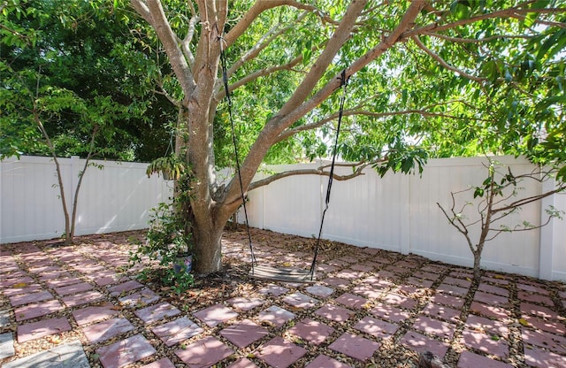 view of yard featuring a patio and a fenced backyard