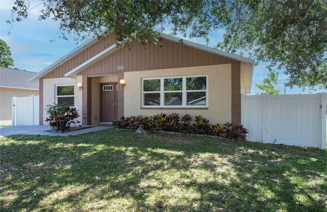 single story home with fence and a front yard