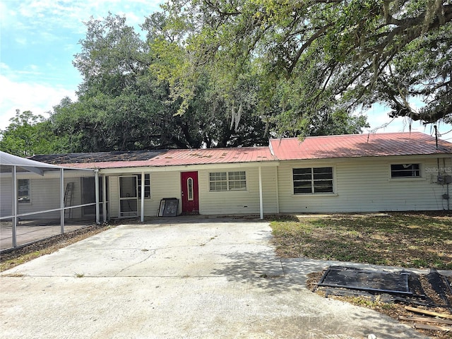 5045 Swindell Rd, Lakeland, FL 33810 - ranch-style house featuring metal roof and concrete driveway