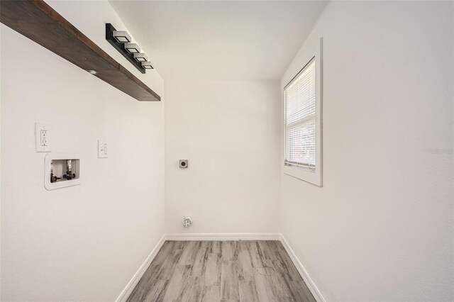 washroom with washer hookup, laundry area, electric dryer hookup, light wood-type flooring, and baseboards