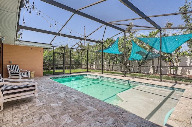 view of pool with a fenced in pool, a fenced backyard, a patio area, and a lanai