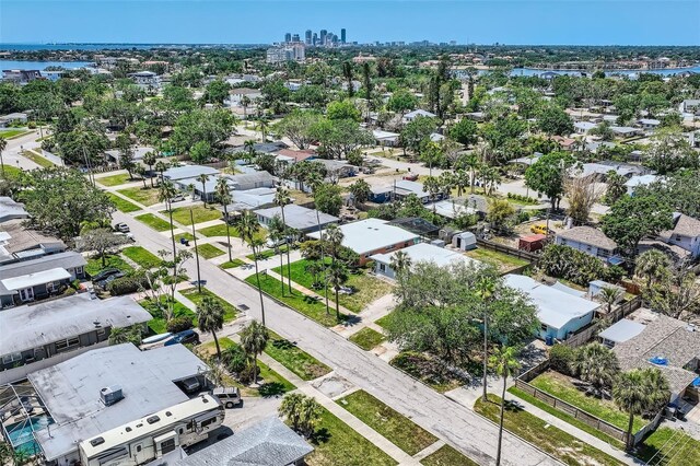 drone / aerial view with a water view and a residential view