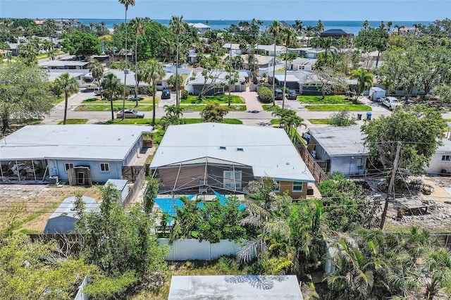 bird's eye view featuring a water view and a residential view