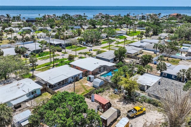 birds eye view of property featuring a residential view and a water view