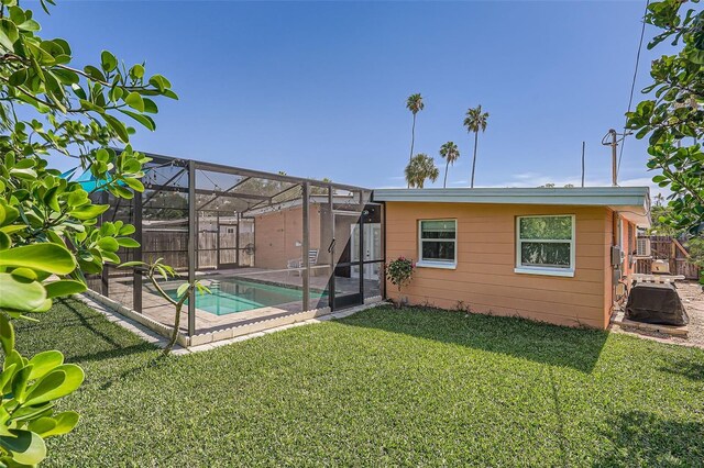4018 Indianapolis St NE, Saint Petersburg, FL 33703 - back of house with a patio and glass enclosure