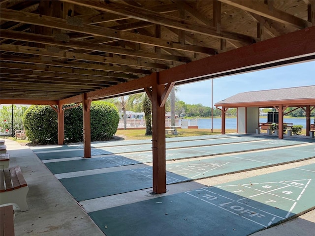 view of property's community featuring shuffleboard