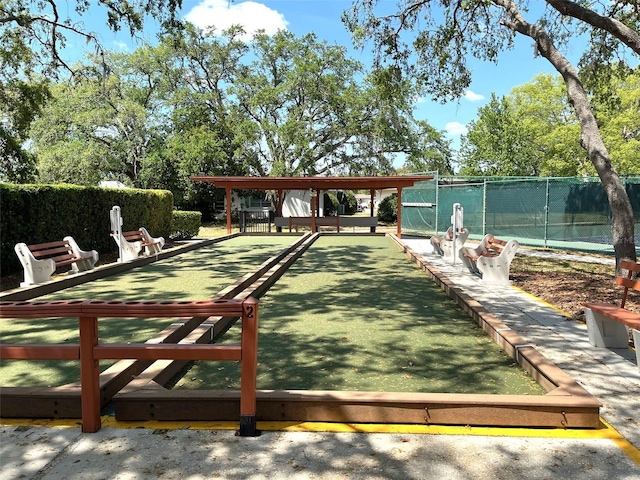 view of community with fence