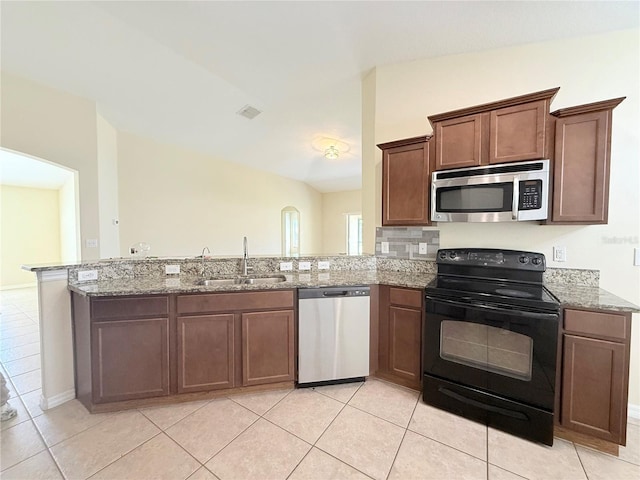 13181 Royal Pines Ave, Riverview, FL 33579 - kitchen with appliances with stainless steel finishes, a sink, light stone counters, and light tile patterned floors
