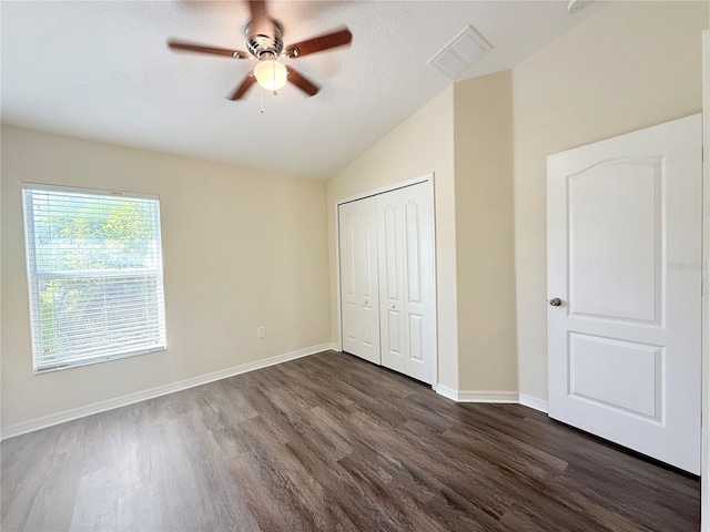 13181 Royal Pines Ave, Riverview, FL 33579 - unfurnished bedroom with lofted ceiling, dark wood-style flooring, a closet, baseboards, and ceiling fan