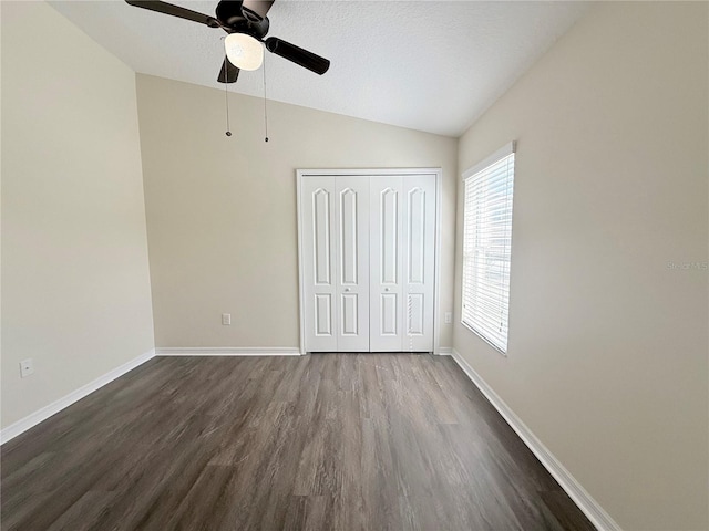 13181 Royal Pines Ave, Riverview, FL 33579 - unfurnished bedroom featuring lofted ceiling, dark wood-style floors, baseboards, a closet, and a ceiling fan