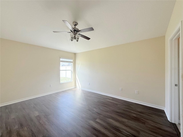 13181 Royal Pines Ave, Riverview, FL 33579 - spare room featuring dark wood-style floors, ceiling fan, and baseboards