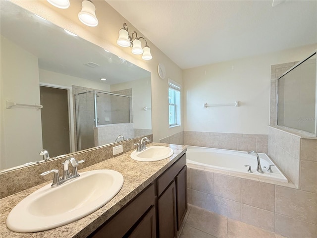 13181 Royal Pines Ave, Riverview, FL 33579 - bathroom featuring a garden tub, a shower stall, tile patterned floors, and double vanity