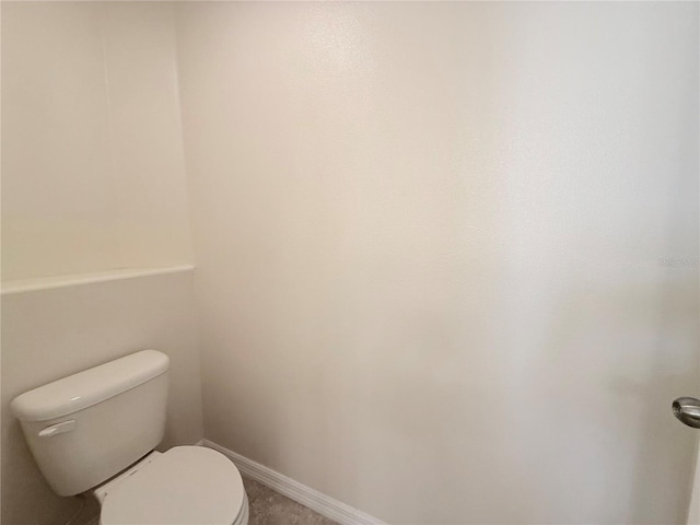 13181 Royal Pines Ave, Riverview, FL 33579 - bathroom featuring toilet and baseboards