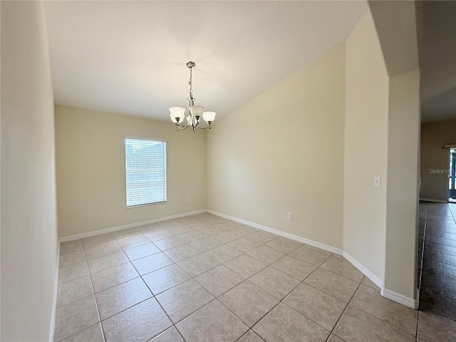 13181 Royal Pines Ave, Riverview, FL 33579 - unfurnished room featuring light tile patterned flooring, a chandelier, and baseboards
