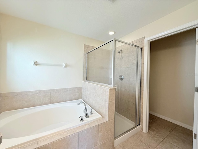 13181 Royal Pines Ave, Riverview, FL 33579 - full bath featuring a shower stall, tile patterned floors, and a bath