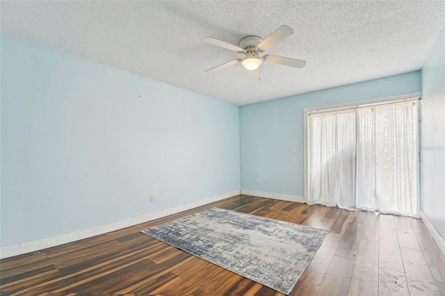 1515 12th Ct SE Unit 55, Largo, FL 33771 - unfurnished room featuring ceiling fan, a textured ceiling, wood finished floors, and baseboards