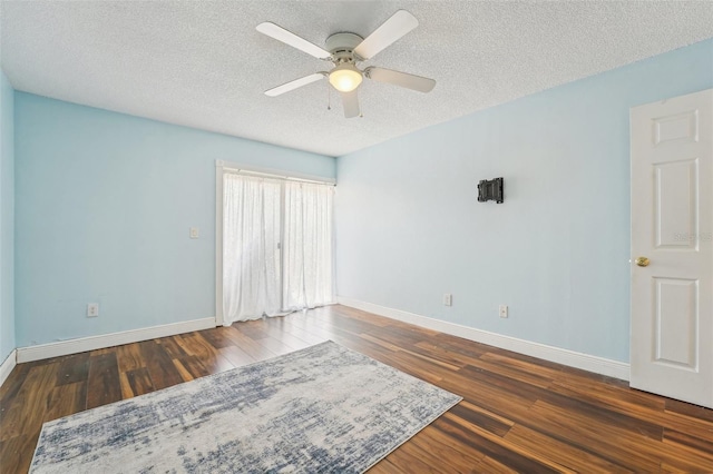 1515 12th Ct SE Unit 55, Largo, FL 33771 - spare room with wood finished floors, baseboards, and a textured ceiling