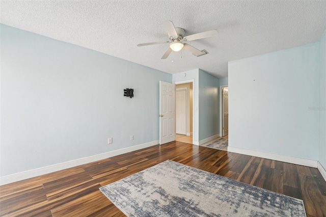 1515 12th Ct SE Unit 55, Largo, FL 33771 - unfurnished room with wood finished floors, baseboards, ceiling fan, and a textured ceiling