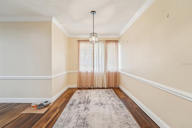 1515 12th Ct SE Unit 55, Largo, FL 33771 - spare room featuring a chandelier, dark wood-type flooring, a textured ceiling, baseboards, and crown molding