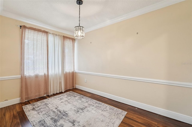 1515 12th Ct SE Unit 55, Largo, FL 33771 - empty room with baseboards, dark wood finished floors, ornamental molding, and a textured ceiling