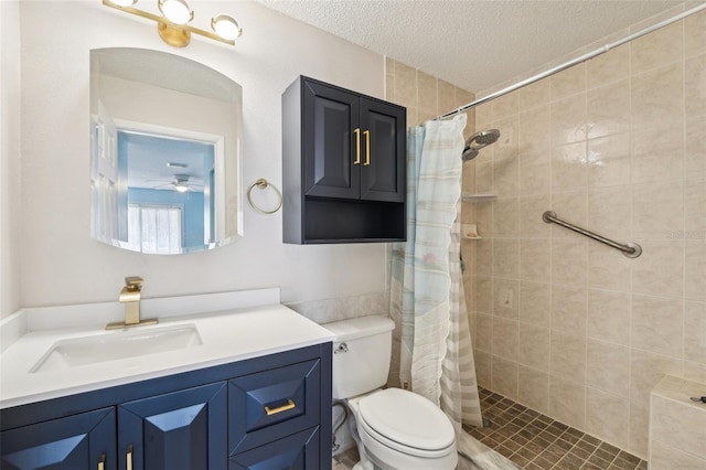 1515 12th Ct SE Unit 55, Largo, FL 33771 - bathroom with vanity, toilet, a textured ceiling, and a tile shower